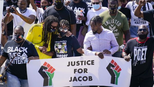 Jacob Blake's sister Letetra Widman and uncle Justin Blake march at a rally for Jacob Blake Saturday, Aug. 29, 2020, in Kenosha, Wis - Sputnik International