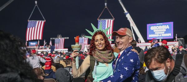 Supporters mingle before a rally with the US president in support of Republican incumbent senators Kelly Loeffler and David Perdue ahead of a Senate runoff in Dalton, Georgia on January 4, 2021. - President Donald Trump, still seeking ways to reverse his election defeat, and President-elect Joe Biden converge on Georgia on Monday for dueling rallies on the eve of runoff votes that will decide control of the US Senate. Trump, a day after the release of a bombshell recording in which he pressures Georgia officials to overturn his November 3 election loss in the southern state, is to hold a rally in the northwest city of Dalton in support of Republican incumbent senators Kelly Loeffler and David Perdue. (Photo by SANDY HUFFAKER / AFP) Supporters mingle before a rally with the US president in support of Republican incumbent senators Kelly Loeffler and David Perdue ahead of a Senate runoff in Dalton, Georgia on January 4, 2021. - President Donald Trump, still seeking ways to reverse his election defeat, and President-elect Joe Biden converge on Georgia on Monday for dueling rallies on the eve of runoff votes that will decide control of the US Senate. Trump, a day after the release of a bombshell recording in which he pressures Georgia officials to overturn his November 3 election loss in the southern state, is to hold a rally in the northwest city of Dalton in support of Republican incumbent senators Kelly Loeffler and David Perdue. (Photo by SANDY HUFFAKER / AFP) - Sputnik International