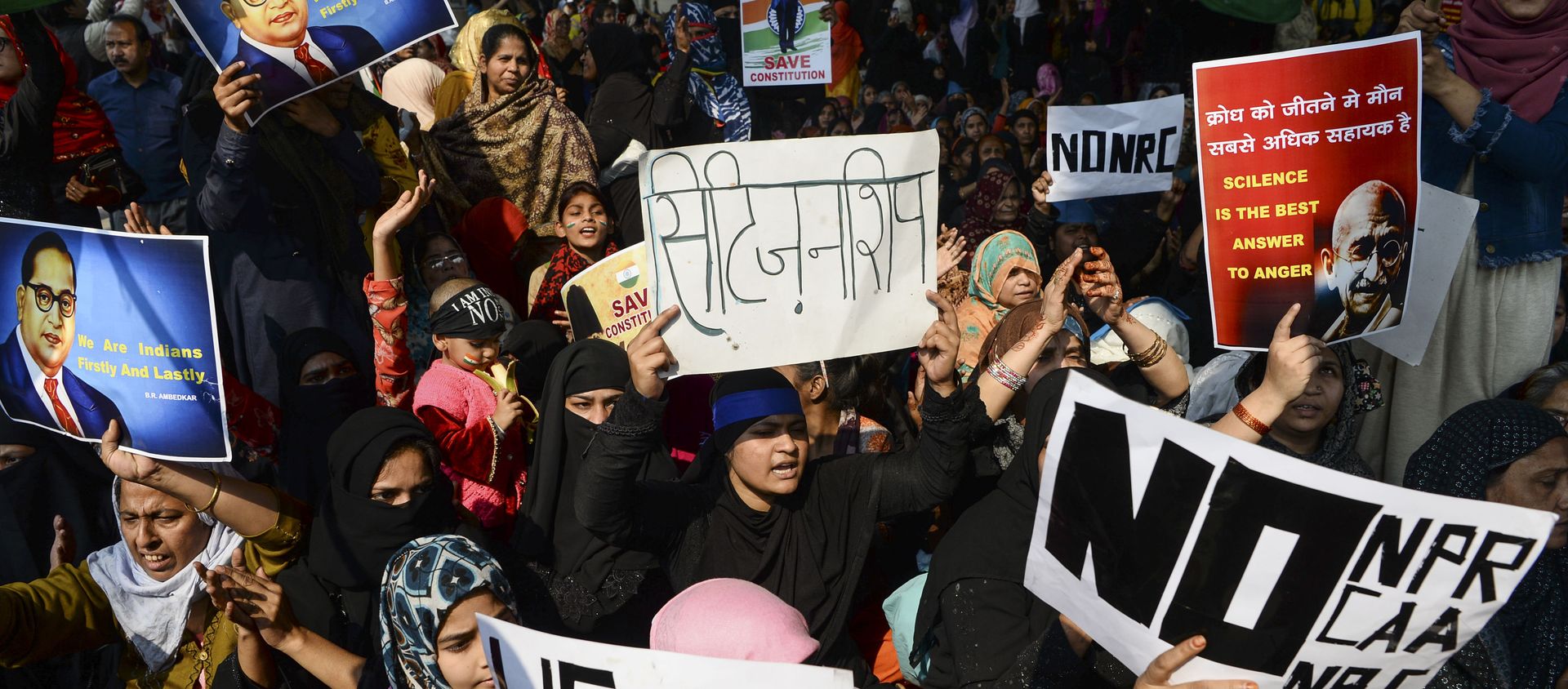 Demonstrators shout slogans and hold placards during a protest against the Indian government's Citizenship Amendment Act (CAA) and the National Register of Citizens (NRC) at Jaffrabad area in New Delhi on February 23, 2020. Demonstrators shout slogans and hold placards during a protest against the Indian government's Citizenship Amendment Act (CAA) and the National Register of Citizens (NRC) at Jaffrabad area in New Delhi on February 23, 2020. - Sputnik International, 1920, 05.01.2021