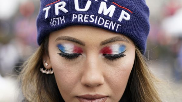 A person attends a rally at Freedom Plaza Tuesday, Jan. 5, 2021, in Washington, in support of President Donald Trump. A person attends a rally at Freedom Plaza Tuesday, Jan. 5, 2021, in Washington, in support of President Donald Trump. - Sputnik International