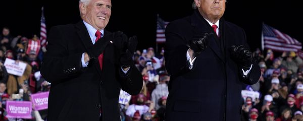 President Donald Trump and Vice President Mike Pence smile after a campaign rally at Gerald R. Ford International Airport, early Tuesday, Nov. 3, 2020, in Grand Rapids, Mich - Sputnik International
