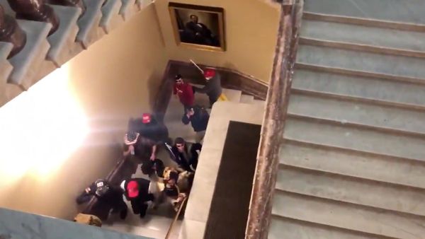 Screenshot captures a group of pro-Trump supporters storming the US Capitol Building amid Congress' certification of the Electoral College results. - Sputnik International