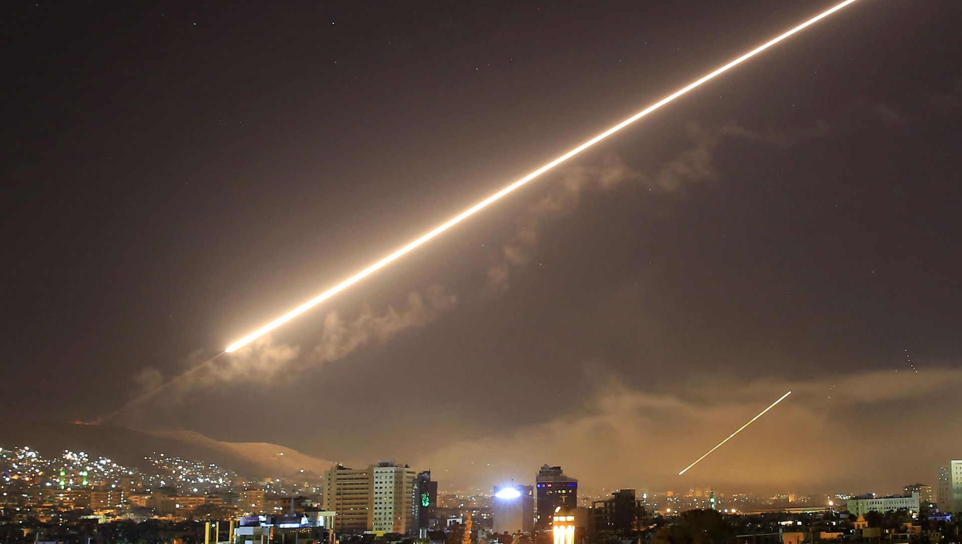 In this April 14, 2018 file photo, Damascus skies erupt with surface to air missile fire as the U.S. launches an attack on Syria targeting different parts of the Syrian capital Damascus, Syria. In this April 14, 2018 file photo, Damascus skies erupt with surface to air missile fire as the U.S. launches an attack on Syria targeting different parts of the Syrian capital Damascus, Syria. - Sputnik International, 1920, 25.02.2021