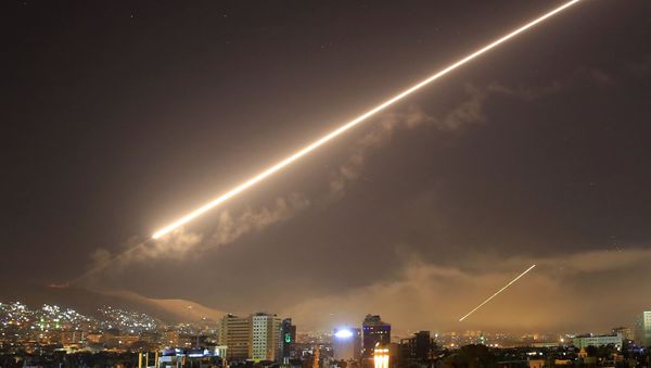 In this April 14, 2018 file photo, Damascus skies erupt with surface to air missile fire as the U.S. launches an attack on Syria targeting different parts of the Syrian capital Damascus, Syria. - Sputnik International