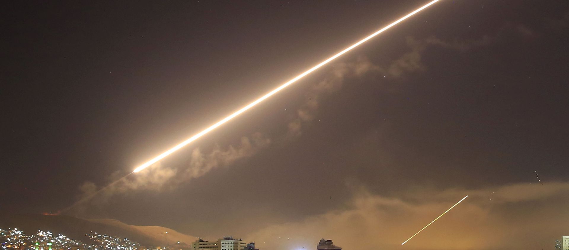 In this April 14, 2018 file photo, Damascus skies erupt with surface to air missile fire as the U.S. launches an attack on Syria targeting different parts of the Syrian capital Damascus, Syria. In this April 14, 2018 file photo, Damascus skies erupt with surface to air missile fire as the U.S. launches an attack on Syria targeting different parts of the Syrian capital Damascus, Syria. - Sputnik International, 1920, 28.02.2021