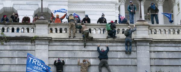 Supporters of President Donald Trump climb the west wall of the the U.S. Capitol on Wednesday, Jan. 6, 2021, in Washington. (AP Photo/Jose Luis Magana) Supporters of President Donald Trump climb the west wall of the the U.S. Capitol on Wednesday, Jan. 6, 2021, in Washington. (AP Photo/Jose Luis Magana) - Sputnik International