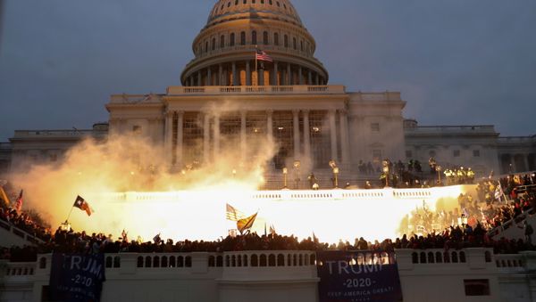 An explosion caused by a police munition is seen while supporters of US President Donald Trump gather in front of the US Capitol Building in Washington, US, January 6, 2021 An explosion caused by a police munition is seen while supporters of US President Donald Trump gather in front of the US Capitol Building in Washington, US, January 6, 2021 - Sputnik International