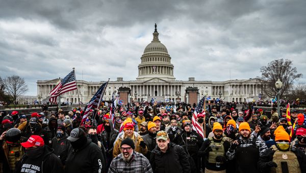 Pro-Trump protesters gather in front of the US Capitol Building on 6 January 2021 in Washington, DC. A pro-Trump mob stormed the Capitol, breaking windows and clashing with police officers. - Sputnik International