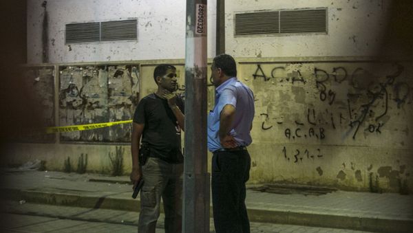Tunisian police officers stand guard after police shot at a man wanted for terrorism in Al Intilaka, near Tunis, Tunisia Tuesday, July 2, 2019.  - Sputnik International