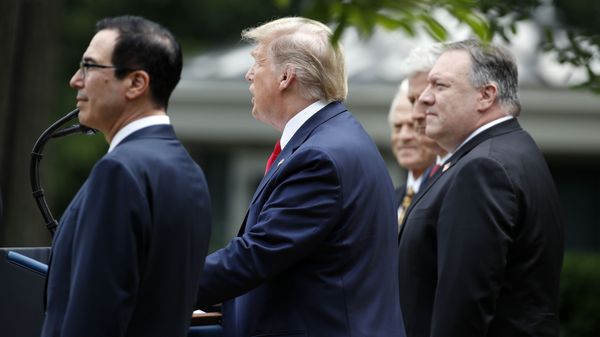 President Donald Trump speaks in the Rose Garden of the White House, Friday, May 29, 2020, in Washington, as from left, Treasury Secretary Steven Mnuchin, White House trade adviser Peter Navarro, left, White House national security adviser Robert O'Brien, and Secretary of State Mike Pompeo, listen - Sputnik International