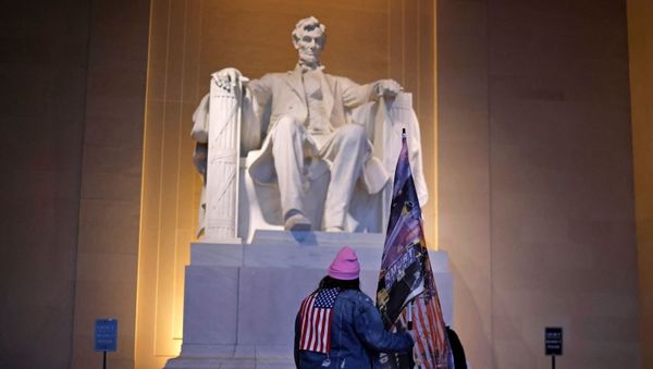 A supporter of U.S. President Donald Trump stands at the Lincoln Memorial, a day after Trump supporters stormed the U.S. Capitol, in Washington, U.S., January 7, 2021. - Sputnik International