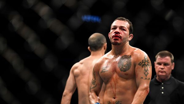 Irwin Rivera (C) of the United States looks on during the fight against Giga Chikadze (L) of Georgia in their Featherweight bout during UFC Fight Night at VyStar Veterans Memorial Arena on May 16, 2020 in Jacksonville, Florida. - Sputnik International