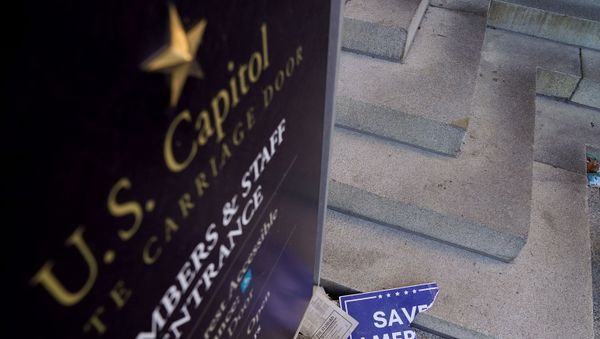 Scraps of a demonstrator's poster lays below a Congressional members and staff entrance sign at the Senate Carriage Entrance of the U.S. Capitol a day after hundreds of supporters of U.S. President Donald Trump occupied the Capitol in Washington Scraps of a demonstrator's poster lays below a Congressional members and staff entrance sign at the Senate Carriage Entrance of the U.S. Capitol a day after hundreds of supporters of U.S. President Donald Trump occupied the Capitol in Washington - Sputnik International