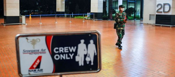 An Indonesian soldier walks at Soekarno-Hatta International Airport after Sriwijaya Air plane flight SJ182 with more than 50 people on board lost contact after taking off, according to local media, in Tangerang, near Jakarta, Indonesia, January 9, 2021. - Sputnik International