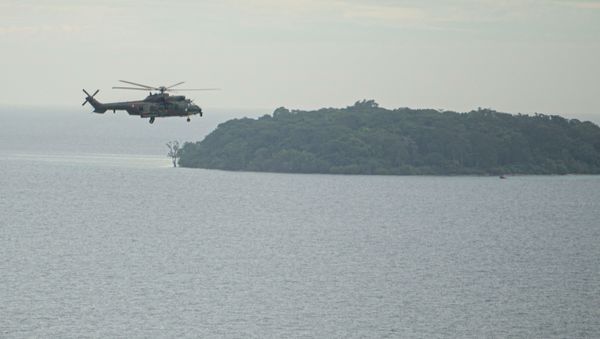EC 725 Caracal helicopter TNI AU fly during an aerial search for the Sriwijaya Air SJ-182, which crashed to the sea in Jakarta, Indonesia, January 10, 2021, in this photo taken by Antara Foto/Aditya Pradana Putra/via Reuters.  ATTENTION EDITORS - THIS IMAGE WAS PROVIDED BY THIRD PARTY. MANDATORY CREDIT. INDONESIA OUT. - Sputnik International