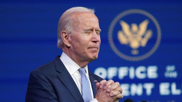 U.S. President-elect Joe Biden clasps his hands in prayer as he speaks about the violent protests in and around the U.S. Capitol in Washington, which forced members of Congress to suspend a joint session to certify the 2020 election results, during brief remarks at Biden's transition headquarters in Wilmington, Delaware, U.S., January 6, 2021. REUTERS/Kevin Lamarque - Sputnik International