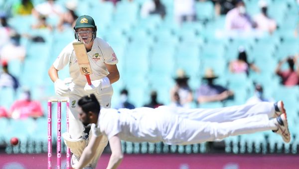Marnus Labuschagne of Australia looks on as Mohammed Siraj of India dives for the ball during day four of the third test match between Australia and India at the SCG, Sydney, Australia, January 10, 2021 - Sputnik International