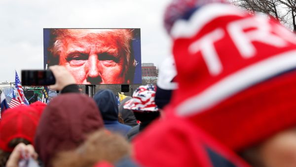 U.S. President Donald Trump is seen on a screen speaking to supporters during a rally to contest the certification of the 2020 U.S. presidential election results by the U.S. Congress, in Washington, U.S, January 6, 2021 - Sputnik International