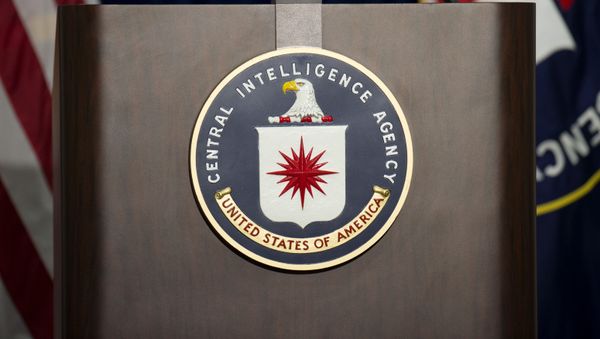 The lectern with CIA logo stands empty as reporters await the arrival of Director of Central Intelligence Agency John Brennan for a press conference at CIA headquarters in Langley, Virginia, December 11, 2014. The lectern with CIA logo stands empty as reporters await the arrival of Director of Central Intelligence Agency John Brennan for a press conference at CIA headquarters in Langley, Virginia, December 11, 2014. - Sputnik International