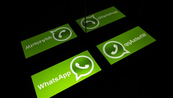 (FILES) This file photo taken on October 5, 2020 shows the logo of mobile messaging service WhatsApp on a tablet screen in Toulouse, southwestern France - Sputnik International