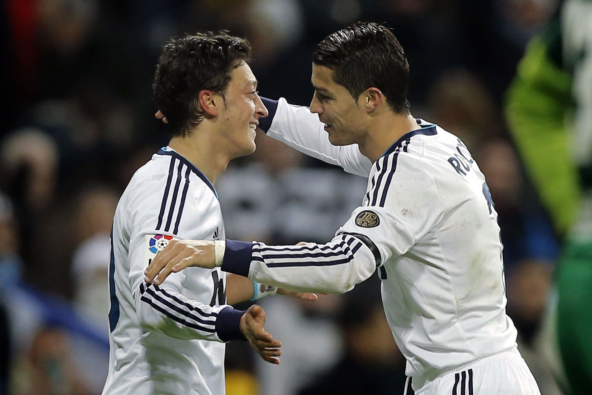 Real Madrid's Mesut Ozil from Germany, left, celebrates with Cristiano Ronaldo from Portugal after scoring a goal against Atletico de Madrid during a Spanish La Liga soccer match at the Santiago Bernabeu stadium in Madrid, Saturday, Dec. 1, 2012 Real Madrid's Mesut Ozil from Germany, left, celebrates with Cristiano Ronaldo from Portugal after scoring a goal against Atletico de Madrid during a Spanish La Liga soccer match at the Santiago Bernabeu stadium in Madrid, Saturday, Dec. 1, 2012 - Sputnik International, 1920, 07.09.2021