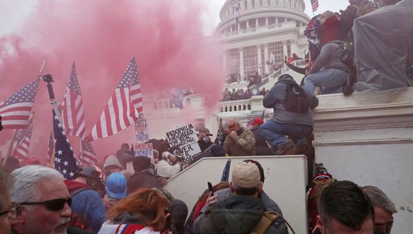 A cloud of colored smoke appears as a mob of supporters of U.S. President Donald Trump storm the U.S. Capitol Building in Washington, U.S., January 6, 2021. Picture taken January 6, 2021.  - Sputnik International