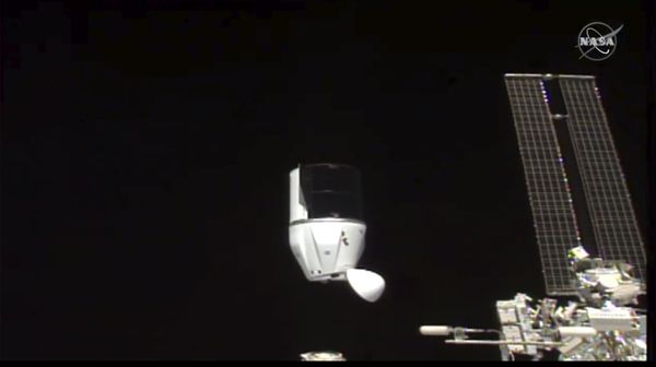 This photo provided by NASA shows SpaceX's Dragon undocking from International Space Station on Tuesday, Jan. 12, 2021.  SpaceX's Dragon cargo capsule undocked with 12 bottles of Bordeaux wine and hundreds of snippets of Merlot and Cabernet Sauvignon vines - Sputnik International