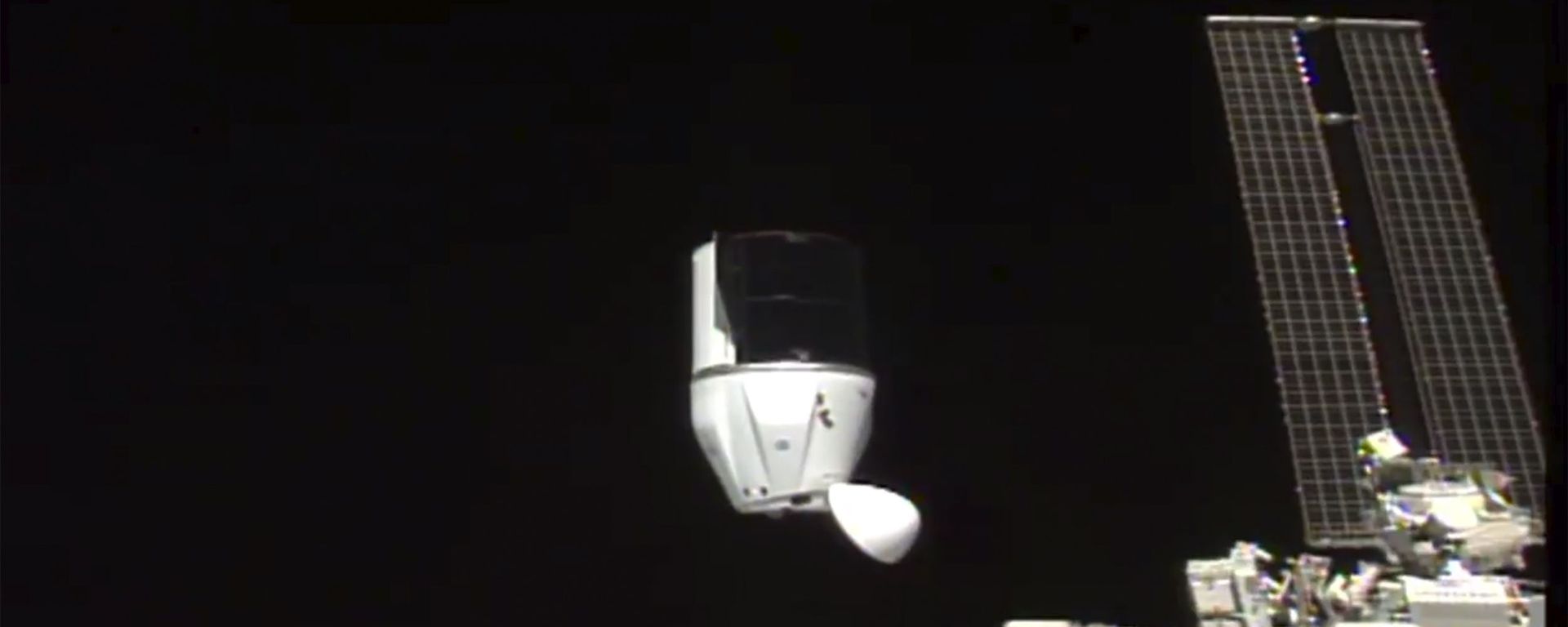 This photo provided by NASA shows SpaceX's Dragon undocking from International Space Station on Tuesday, Jan. 12, 2021.  SpaceX's Dragon cargo capsule undocked with 12 bottles of Bordeaux wine and hundreds of snippets of Merlot and Cabernet Sauvignon vines - Sputnik International, 1920, 17.03.2023
