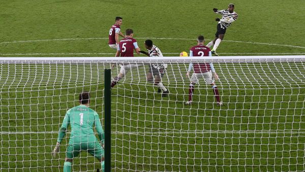 Manchester United's French midfielder Paul Pogba (2R) scores the opening goal during the English Premier League football match between Burnley and Manchester United at Turf Moor in Burnley, north west England on January 12, 2021. Manchester United's French midfielder Paul Pogba (2R) scores the opening goal during the English Premier League football match between Burnley and Manchester United at Turf Moor in Burnley, north west England on January 12, 2021. - Sputnik International