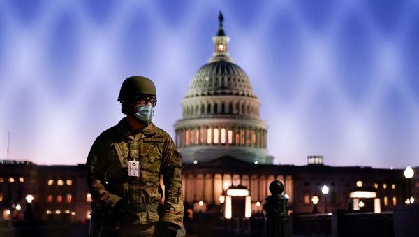  Members of the National Guard gather at the U.S. Capitol as the House of Representatives prepares to begin the voting process on a resolution demanding U.S. Vice President Pence and the cabinet remove President Trump from office, in Washington, U.S., January 12, 2021 - Sputnik International