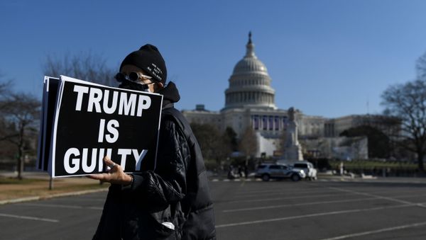 Laurie Arbeiter protests against U.S President Donald Trump near the U.S. Capitol building, as the House of Representatives debates impeaching U.S. President Donald Trump a week after his supporters stormed the Capitol building in Washington, U.S., January 13, 2021.   - Sputnik International