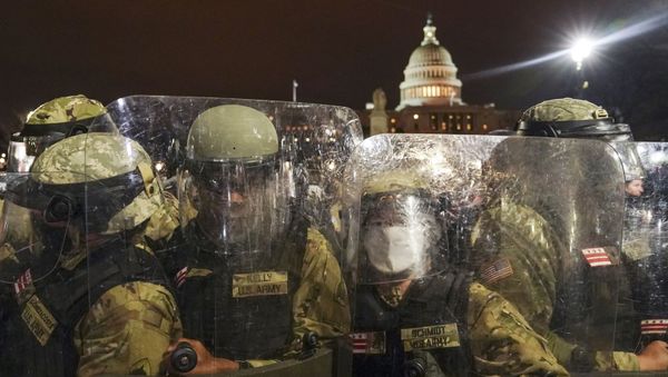 DC National Guard stand outside the Capitol, Wednesday night, Jan. 6, 2021, after a day of rioting protesters. It's been a stunning day as a number of lawmakers and then the mob of protesters tried to overturn America's presidential election, undercut the nation's democracy and keep Democrat Joe Biden from replacing Trump in the White House. - Sputnik International