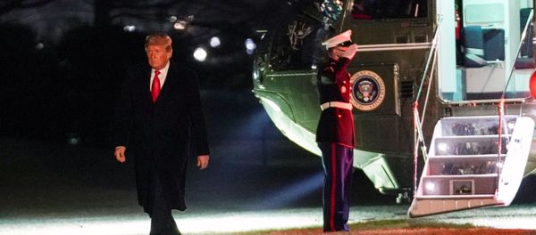 U.S. President Donald Trump walks from Marine One upon his return to the White House in Washington, U.S., January 12, 2021.   - Sputnik International