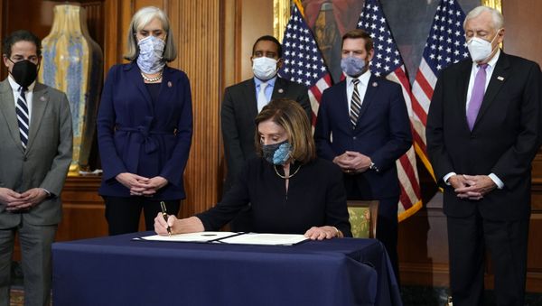 House Speaker Nancy Pelosi of Calif., signs the article of impeachment against President Donald Trump in an engrossment ceremony before transmission to the Senate for trial on Capitol Hill, in Washington, Wednesday, Jan. 13, 2021.  - Sputnik International
