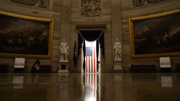 Light shines on an American flag as seen from the Capitol Rotunda in Washington, Wednesday, Jan. 13, 2021.  - Sputnik International