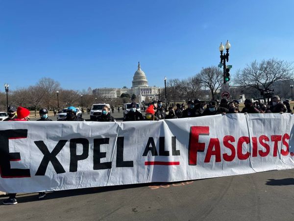 Protesters hold a banner outside the US Capitol. Protesters hold a banner outside the US Capitol. - Sputnik International