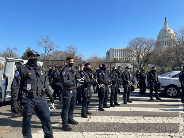 Police officers stand guard outside the US Capitol building as the House of Representatives votes to impeach Trump. Police officers stand guard outside the US Capitol building as the House of Representatives votes to impeach Trump. - Sputnik International