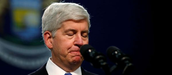 Michigan Governor Rick Snyder pauses as he speaks at North Western High School in Flint, a city struggling with the effects of lead-poisoned drinking water in Michigan, May 4, 2016. REUTERS/Carlos Barria/File Photo Michigan Governor Rick Snyder pauses as he speaks at North Western High School in Flint, a city struggling with the effects of lead-poisoned drinking water in Michigan, May 4, 2016. REUTERS/Carlos Barria/File Photo - Sputnik International