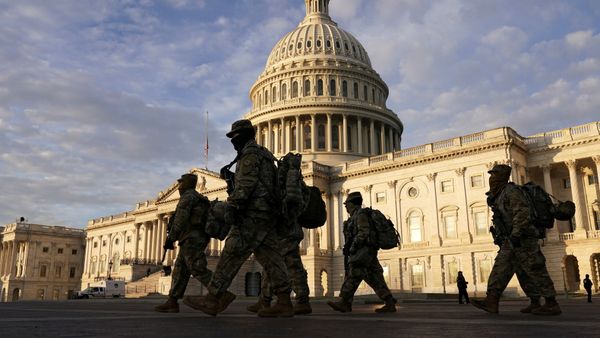 National Guard members walk in front of the U.S. Capitol after the House voted to impeach U.S. President Donald Trump in Washington, U.S., January 14, 2021 - Sputnik International
