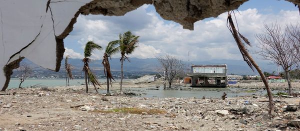 Ruins and damaged building are pictured nearly one year after an earthquake and tsunami at a beach in Palu, Central Sulawesi, Indonesia Ruins and damaged building are pictured nearly one year after an earthquake and tsunami at a beach in Palu, Central Sulawesi, Indonesia - Sputnik International