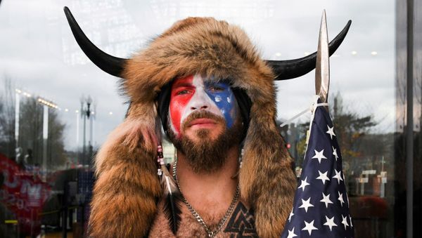  Jacob Anthony Chansley, also known as Jake Angeli, of Arizona, poses with his face painted in the colors of the U.S. flag as supporters of U.S. President Donald Trump gather in Washington, U.S. January 6, 2021 - Sputnik International