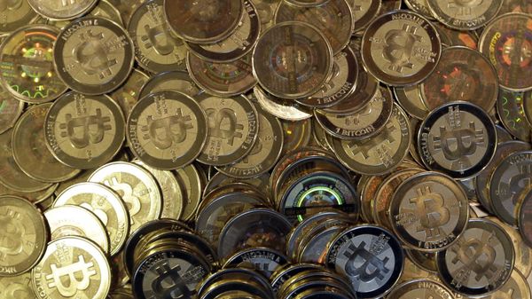 This April 3, 2013, file photo shows bitcoin tokens in Sandy, Utah. Unidentified hackers broke into the Twitter accounts of technology moguls, politicians, celebrities and major companies Wednesday, July 15, 2020, in an apparent Bitcoin scam - Sputnik International