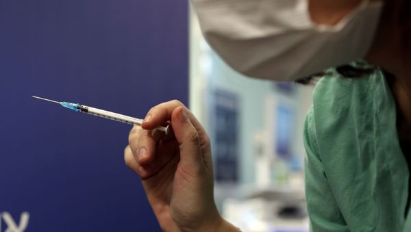 A medical worker prepares to administer a second vaccination injection against the coronavirus disease as Israel continues its national vaccination drive, during a third national COVID-19 lockdown, at Tel Aviv Sourasky Medical Center (Ichilov Hospital) in Tel Aviv, Israel  - Sputnik International