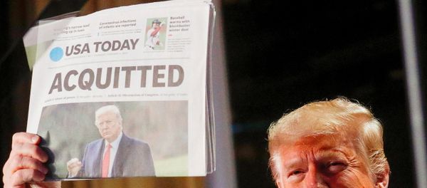 U.S. President Donald Trump holds up a copy of USA Today's front page showing news of his acquittal in his Senate impeachment trial, as he arrives to address the National Prayer Breakfast in Washington, U.S., February 6, 2020 U.S. President Donald Trump holds up a copy of USA Today's front page showing news of his acquittal in his Senate impeachment trial, as he arrives to address the National Prayer Breakfast in Washington, U.S., February 6, 2020 - Sputnik International
