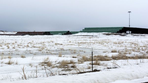 This March 11, 2020 photo provided by the Bureau of Land Management shows a storage yard north of Saco, Mont., for pipe that will be used in construction of the Keystone XL oil pipeline near the U.S.-Canada border. A Canadian company said Monday, April 6, 2020, that it's started construction on the long-stalled Keystone XL oil sands pipeline across the U.S.-Canada border, despite calls from tribal leaders and environmentalists to delay the $8 billion project amid the coronavirus pandemic. - Sputnik International