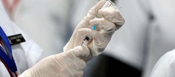 A healthcare worker fills a syringe with a dose of Bharat Biotech's COVID-19 vaccine called COVAXIN, during the coronavirus disease (COVID-19) vaccination campaign at All India Institute of Medical Sciences (AIIMS) hospital in New Delhi A healthcare worker fills a syringe with a dose of Bharat Biotech's COVID-19 vaccine called COVAXIN, during the coronavirus disease (COVID-19) vaccination campaign at All India Institute of Medical Sciences (AIIMS) hospital in New Delhi - Sputnik International