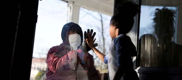 Hashim, an essential worker in the healthcare industry, greets his daughter through the closed door, maintaining social distance from his family as he works with the coronavirus disease (COVID-19) outbreak in New Rochelle, New York, US, 11 April 2020. Hashim, an essential worker in the healthcare industry, greets his daughter through the closed door, maintaining social distance from his family as he works with the coronavirus disease (COVID-19) outbreak in New Rochelle, New York, US, 11 April 2020. - Sputnik International