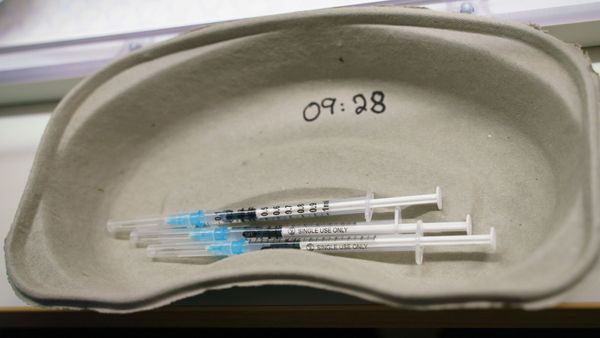 A tray with syringes containing the Pfizer/BioNTech vaccine against the coronavirus disease (COVID-19) are pictured on the opening day of a vaccination centre at the Congress Center in Darmstadt, Germany January 19, 2021 - Sputnik International