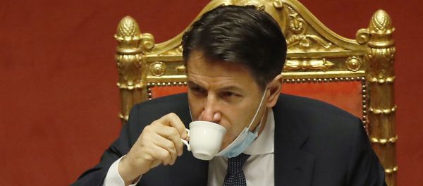 Italian premier Giuseppe Conte sips a coffee during a debate at the Senate prior to a confidence vote, in Rome, Tuesday, Jan. 19, 2021. - Sputnik International