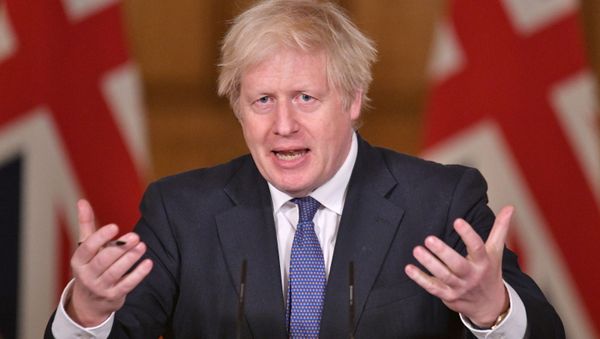 British Prime Minister Boris Johnson gestures at a media briefing on the coronavirus pandemic in Downing Street, London, Britain January 15, 2021 - Sputnik International